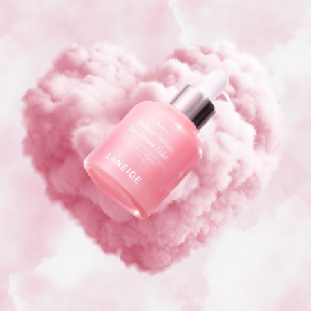 Laneige Glowy Makeup Serum floating in pink cloud heart background with soft luminous glow